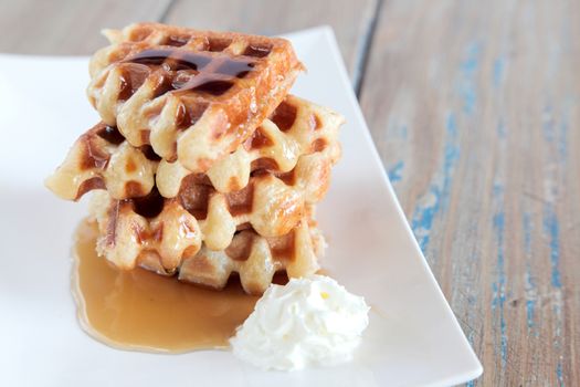 Maple syrup waffle with vanilla whipped cream