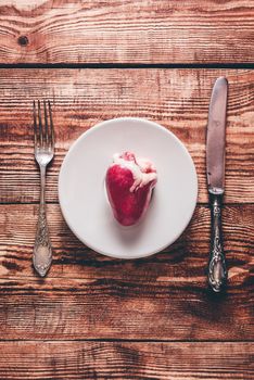 Heart on White Plate with Knife and Fork