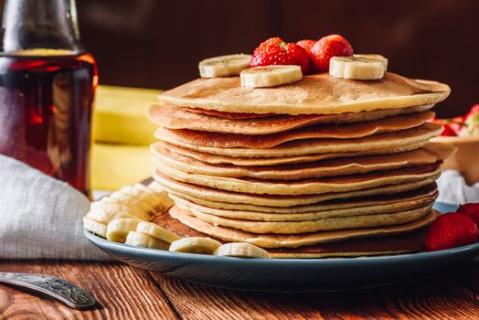 Pancake Stack with Frozen Strawberry and Sliced Banana.