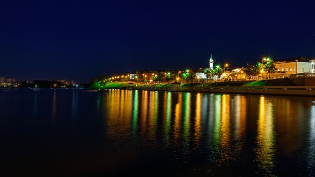 The city of Kazan during a beautiful summer night with multicolor illumination. View of the waterfront of Kaban Lake.