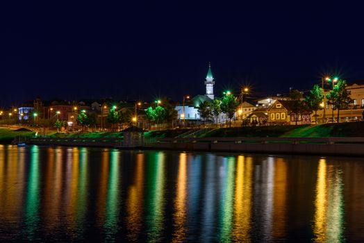 The city of Kazan during a beautiful summer night with colorful lights.. View of the waterfront of Kaban Lake.