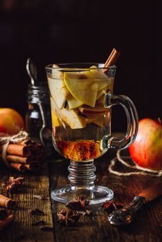Apple Mulled Drink with Different Spices. Vertical Orientation.