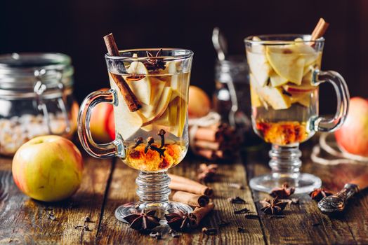 Hot Apple Cider and Ingredients on Wooden Table