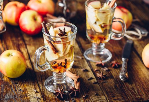 Hot Apple Cider Drink with Ingredients on Table