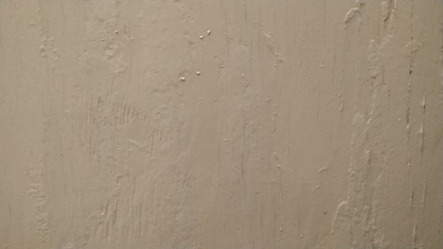 Plaster wall painted with white paint. Background, pattern