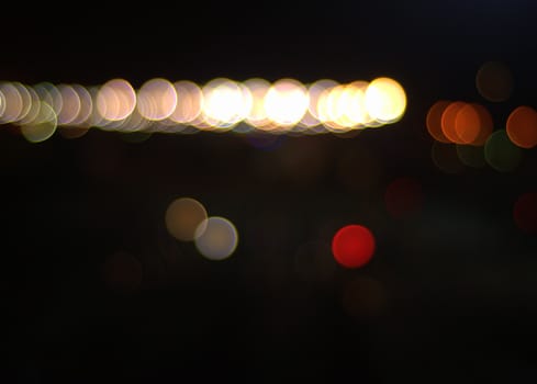 Lights of the night city, the picture was taken in the dark time of the day with defocusing. Blur.