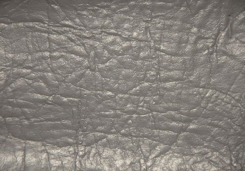 Decorative surface imitating artificially made leather. The picture was taken in the daytime, closeup.