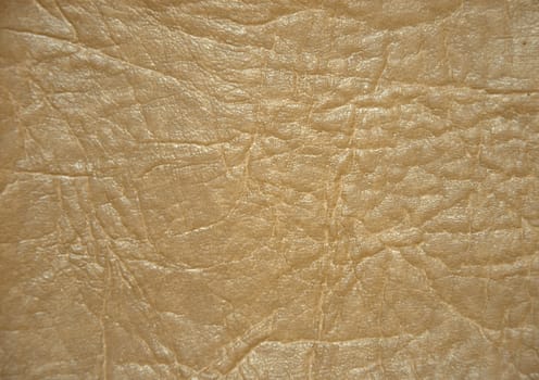 Decorative surface imitating artificially made leather. The picture was taken in the daytime, closeup.