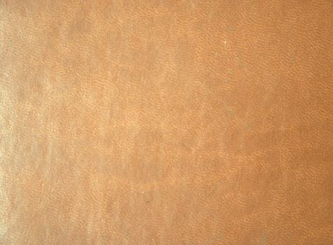 Genuine brown leather. Background. Texture. Close-up.