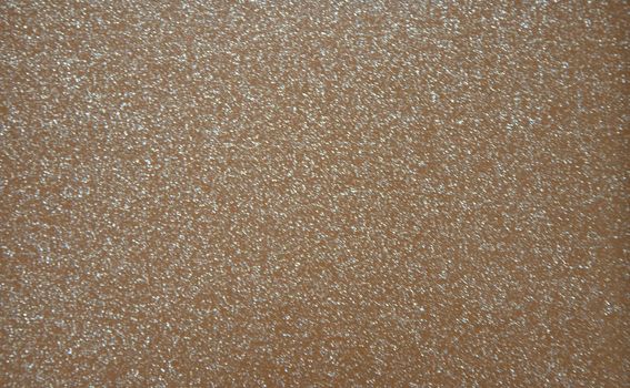Brown pearlescent transparent background with metal splashes. Background. Texture.