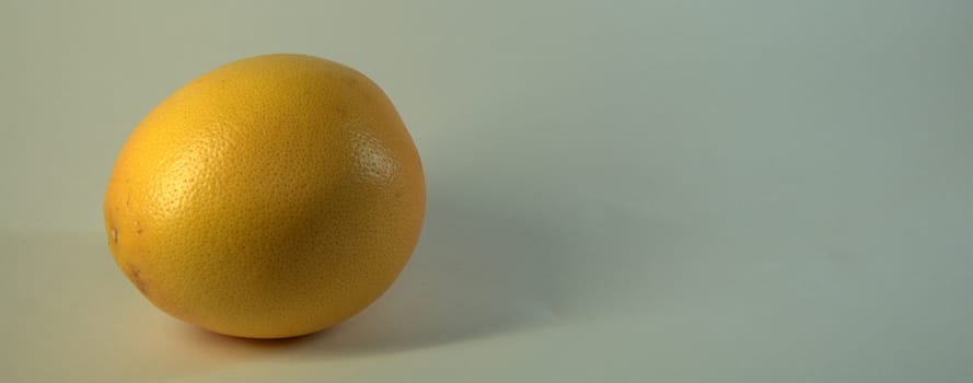 Ripe, juicy, tasty, seductively looking grapefruit fruit. The picture was taken in the lightbox, close-up.