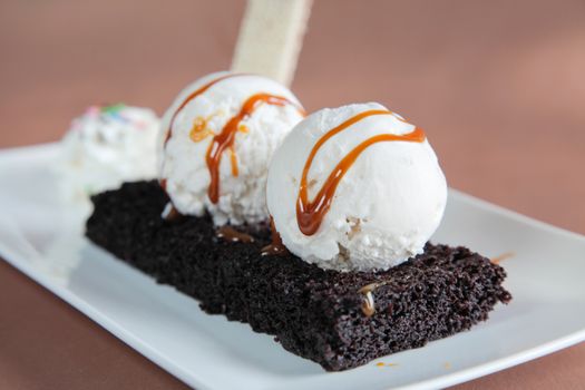Chocolate Brownie with Vanilla Ice Cream and Syrup