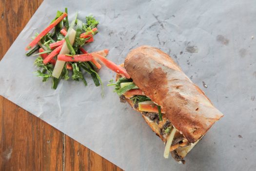 Vietnamese Banh Mi Sandwich and veggies from top angle 