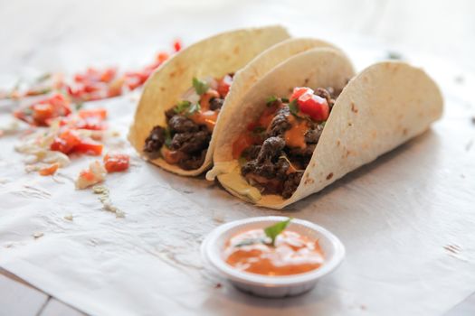 Mexican steak beef tacos with dip condiments