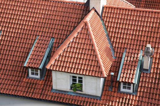European house roof closeup with attic and window