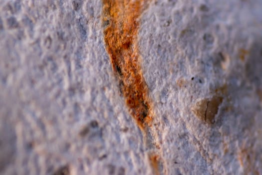 a closeup shoot to old stone with orange scar on it. photo has taken at izmir/turkey.