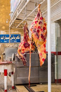 EGYPT, HURGHADA - 04 Avril 2019:Beef district hanged in the open air in front of a butcher's shop in Egypt