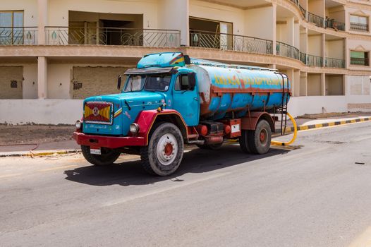 EGYPT, HURGHADA - 04 Avril 2019:Distribution of drinking water with a tanker truck in Hurghada in Egypt