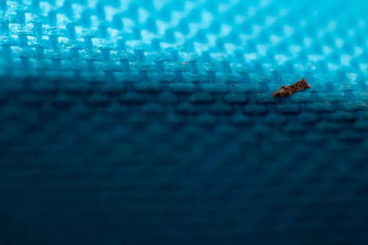 a macro shoot of swollen dirty blue cloth texture. bottom side got shadow.