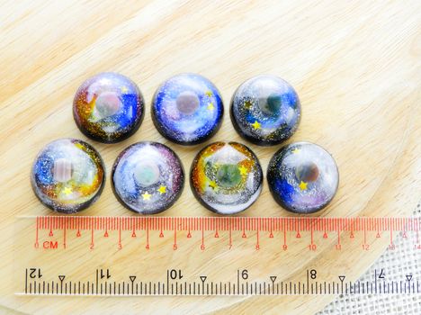 Create galaxy drink coasters using resin, glitter and pigment powders, handmade items. Suitable for keychains, necklace and pendant.
