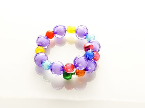 Multi-colored bracelets with beads. Colourful child's bead bracelet.