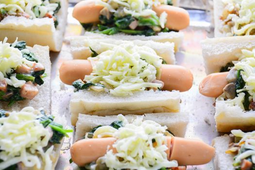 Baked Spinach with Cheese, sausage on Baguette, French bread
