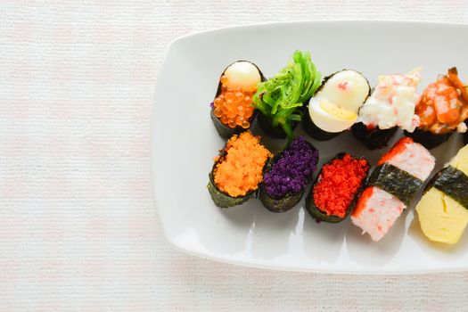 Sushi on white plate, tuna, salmon, sea bass, sweet egg, shrimp sushi, Japanese food