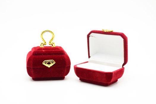 Red velvet box for the ring, fancy ring box, isolated over the white background. Mini red purse ring box.