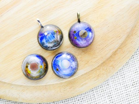 Create galaxy drink coasters using resin, glitter and pigment powders, handmade items. Suitable for keychains, necklace and pendant.