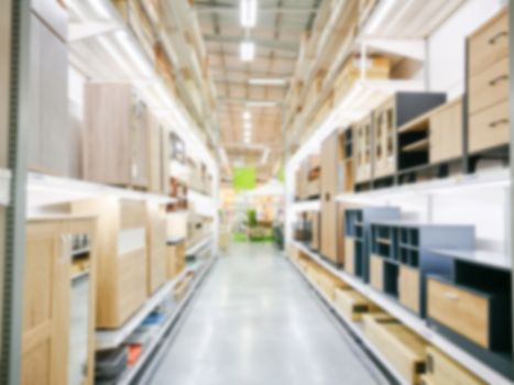 Blur furniture store interior for background. blurry industrial furniture merchandise inventory and wood material.