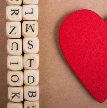 Red Love icon and Letter cubes of made of wood