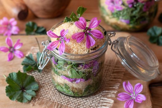 Preparation of herbal syrup against cough from wild common mallow flowers, leaves and cane sugar