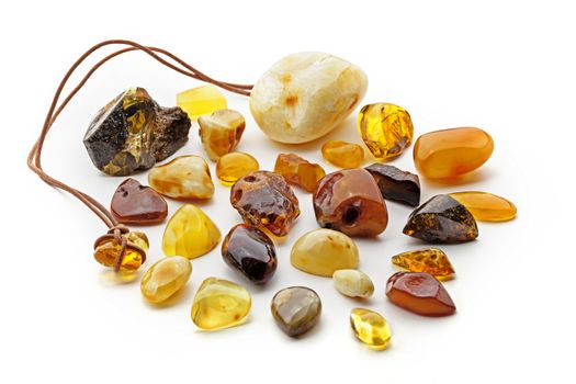 Composition of many pieces of natural amber. Various colors from transparent yellow to dark red, polished with signs of natural origin such as cavity and superficial cracks on its surfaces.