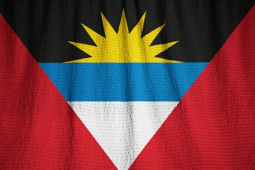 Ruffled Flag of Antigua and Barbuda Blowing in Wind