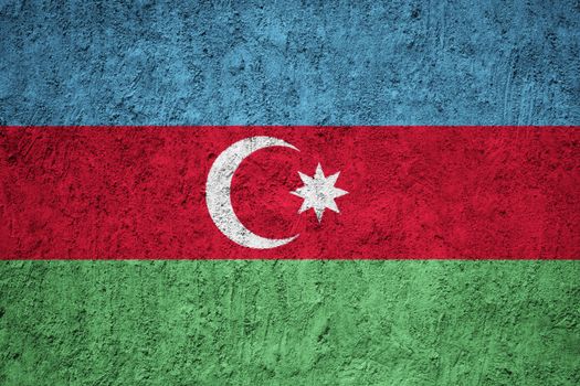 Azerbaijan flag painted on the cracked grunge concrete wall