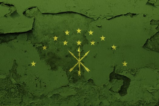 Adygea flag painted on the cracked grunge concrete wall