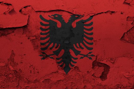 Albania flag painted on the cracked grunge concrete wall