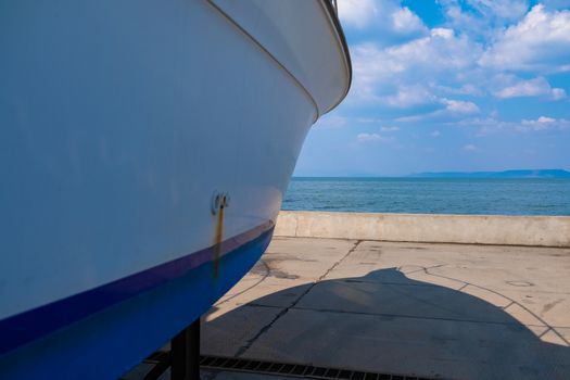 Boats are on the boat station on the pavement.