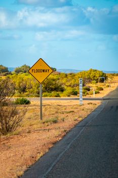 Yellow Flood way street sign in Australian Outback