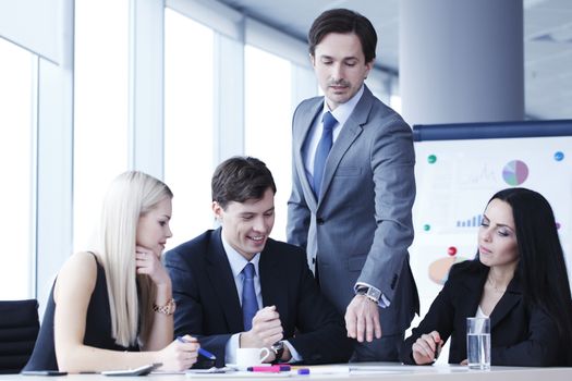 Teamwork of business people discussing reports in office
