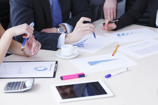 Working business people analyzing financial reports in office