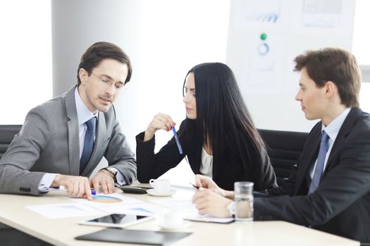 Business people discussing financial reports during a meeting