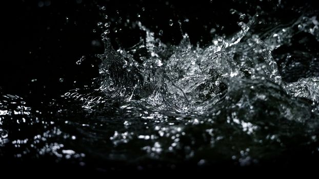 Blurry images of drinking water liquid wave or carbonate drink or oil shape or soda splashing and floating drop in black background for represent sparkling refreshment and refreshing