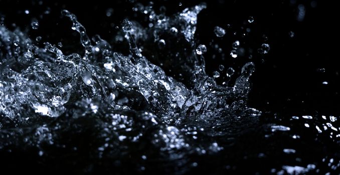 Blurry images of drinking water liquid wave or carbonate drink or oil shape or soda splashing and floating drop in black background for represent sparkling refreshment and refreshing