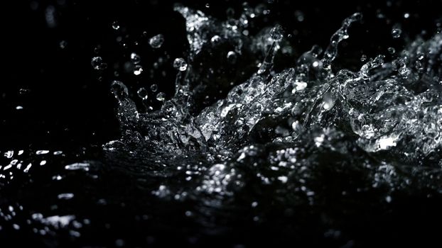 Blurry images of drinking water liquid wave or carbonate drink or oil shape or soda splashing and floating drop in black background for represent sparkling refreshment and refreshing