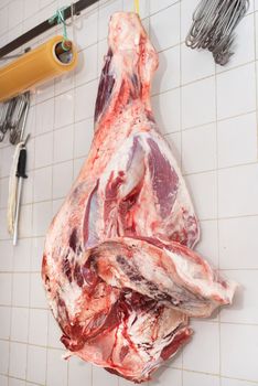 piece of meat hanging in the butcher shop