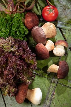Mushrooms and vegetable on an old wood
