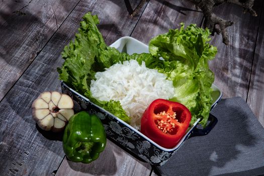 Cabbage and vegetables on a wooden background