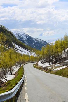 Spring mountains with melting snow and trees in Norway, Stolsheimen