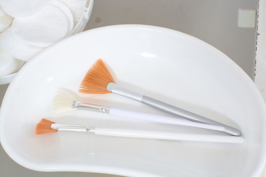 Close-up view of the cosmetic brushes for peeling and facial cleansing. Medical and beauty equipment healthcare. Modern medical and beauty technology concept. 